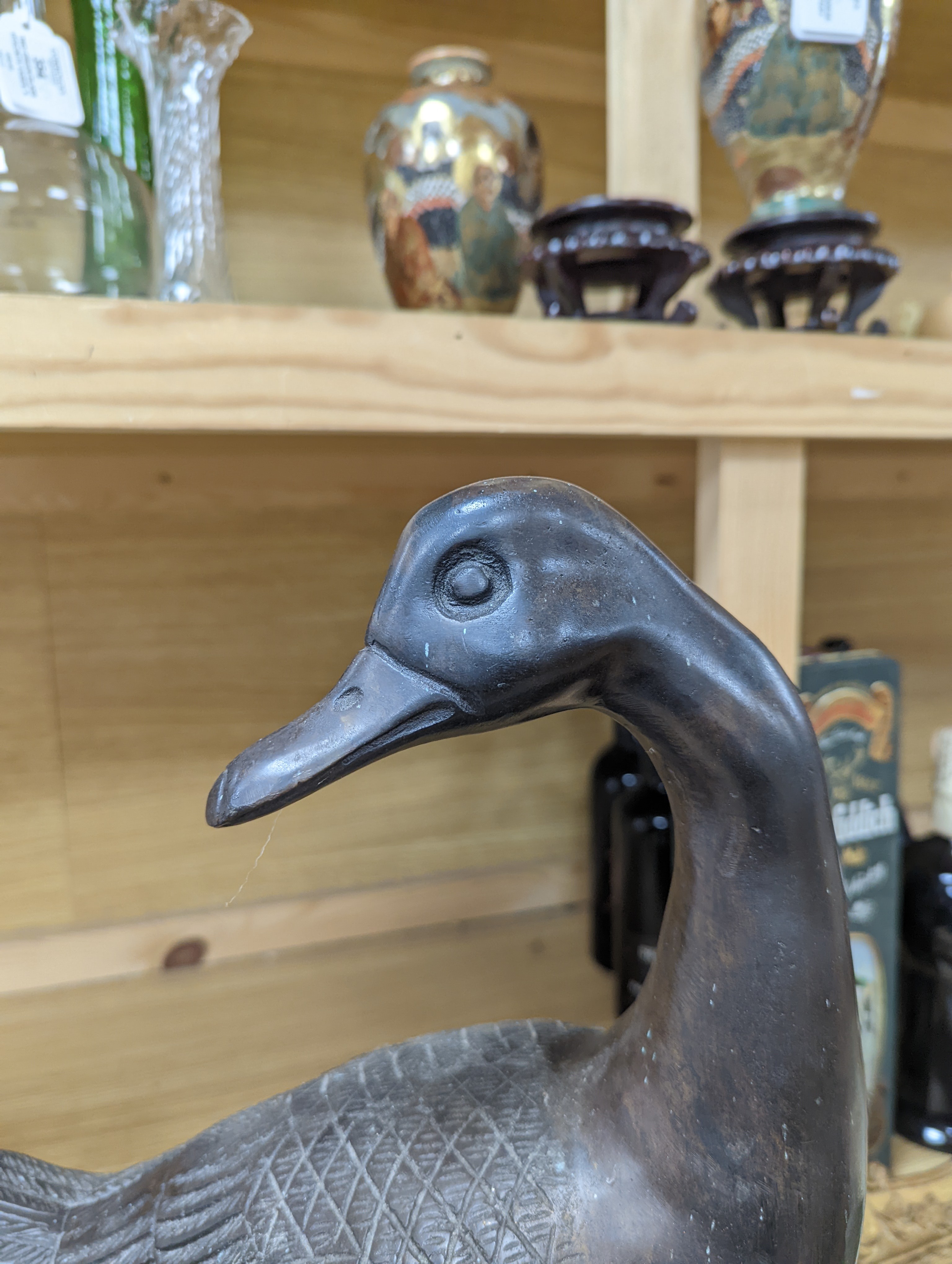 A pair of modern Chinese bronze models of geese, largest 48cm